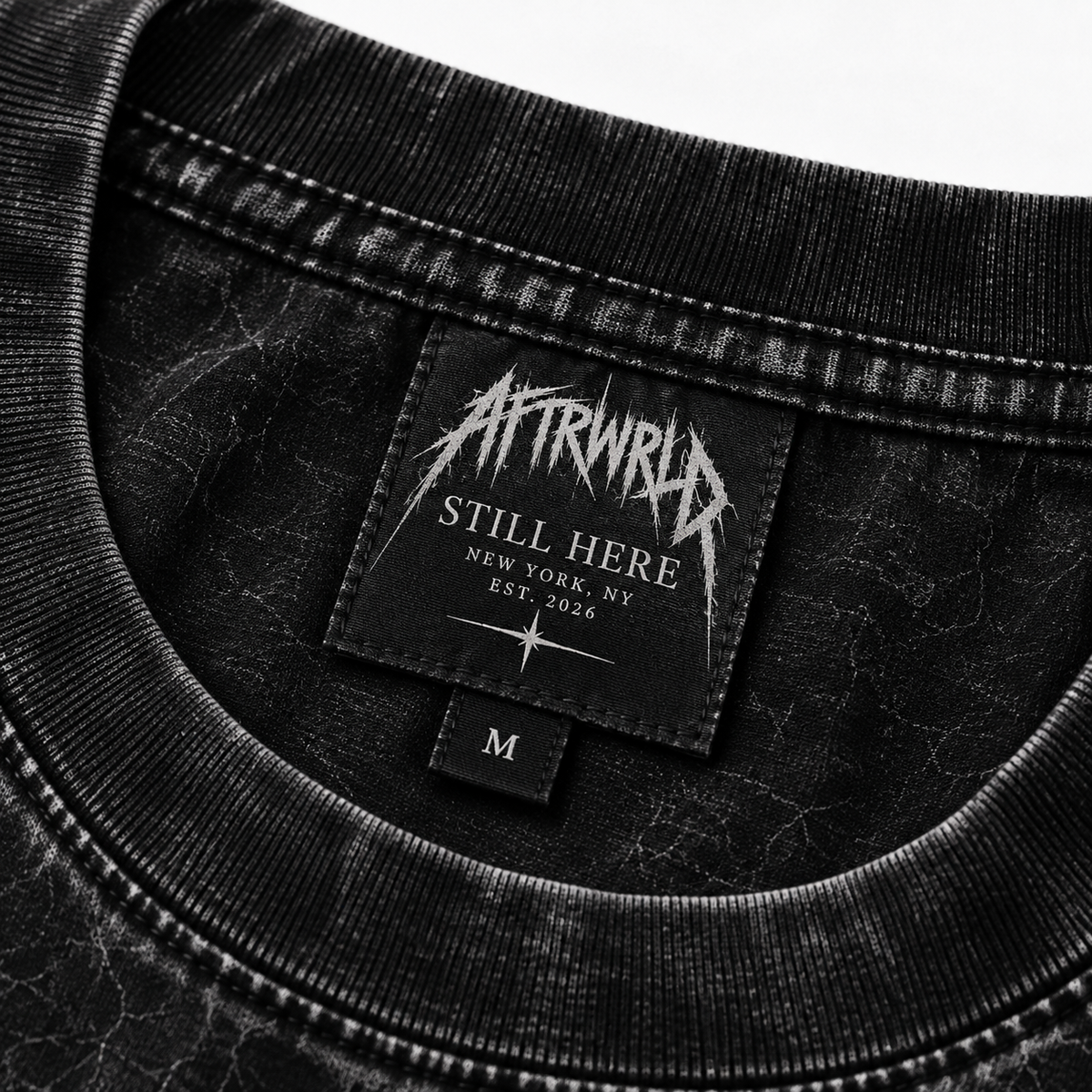 STILL HERE — neck tag EST. 2026